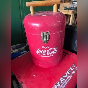 Brand is CocaCola,it’s small but it works! This is a cooler! I hope you enjoy!